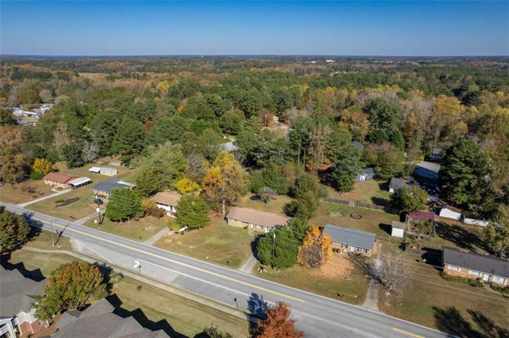 511 Lee Byrd Road Loganville, GA 30052 - Photo 32 of 32 an aerial view of residential houses with outdoor space