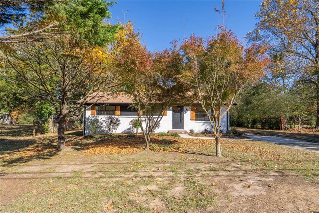 511 Lee Byrd Road Loganville, GA 30052 - Photo 5 of 32 a front view of a house with a yard
