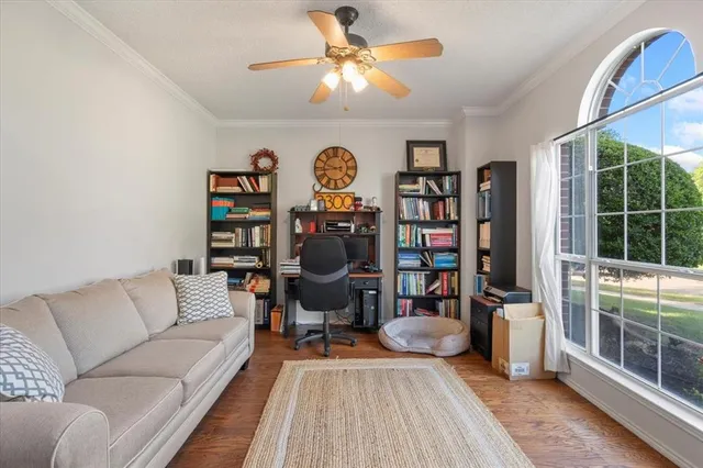 a living room with furniture a rug and a chandelier