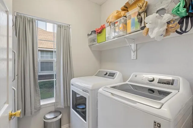 a utility room with dryer and washer