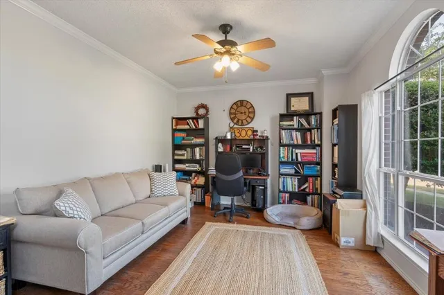 a living room with lots of furniture and a chandelier