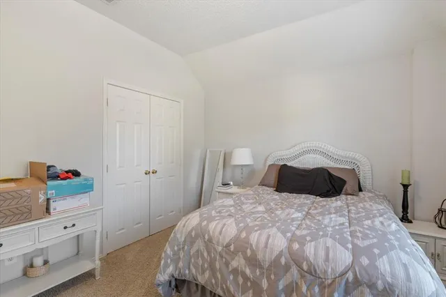 a bedroom with a bed and closet