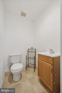 a bathroom with a toilet and a sink