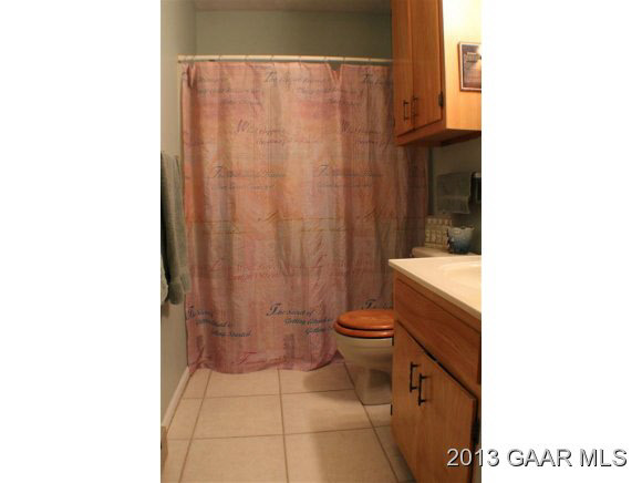 54 Buckboard Road Waynesboro, VA 22980 - Photo 9 of 9 a bathroom with a toilet and a shower curtain