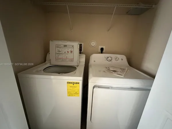 a utility room with dryer and washer