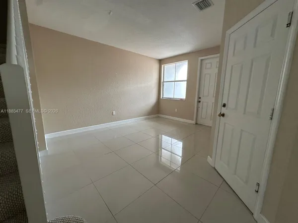 a view of empty room with windows
