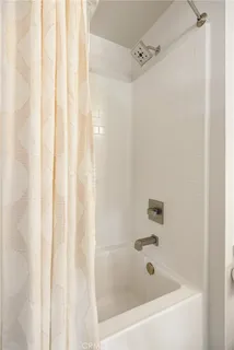 a view of a hallway with washer and dryer