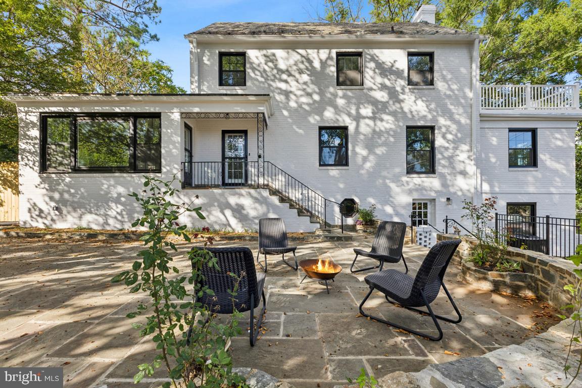 a front view of house with outdoor seating