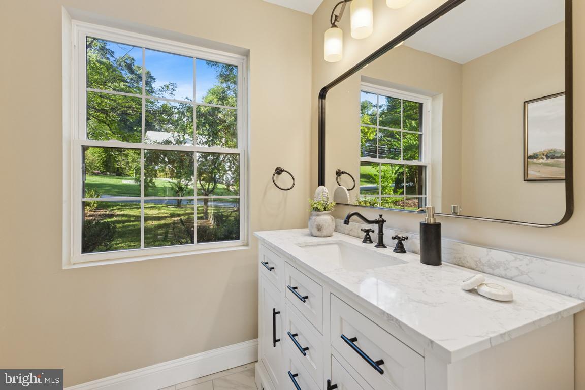 1901 Belle Haven Road Alexandria, VA 22307 - Photo 13 of 52 a bathroom with a sink and a window