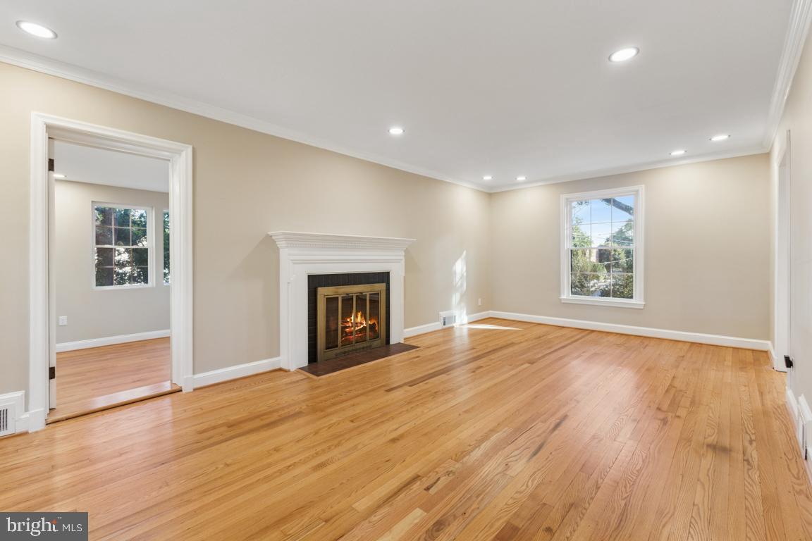 1901 Belle Haven Road Alexandria, VA 22307 - Photo 16 of 52 a view of an empty room with wooden floor and a window