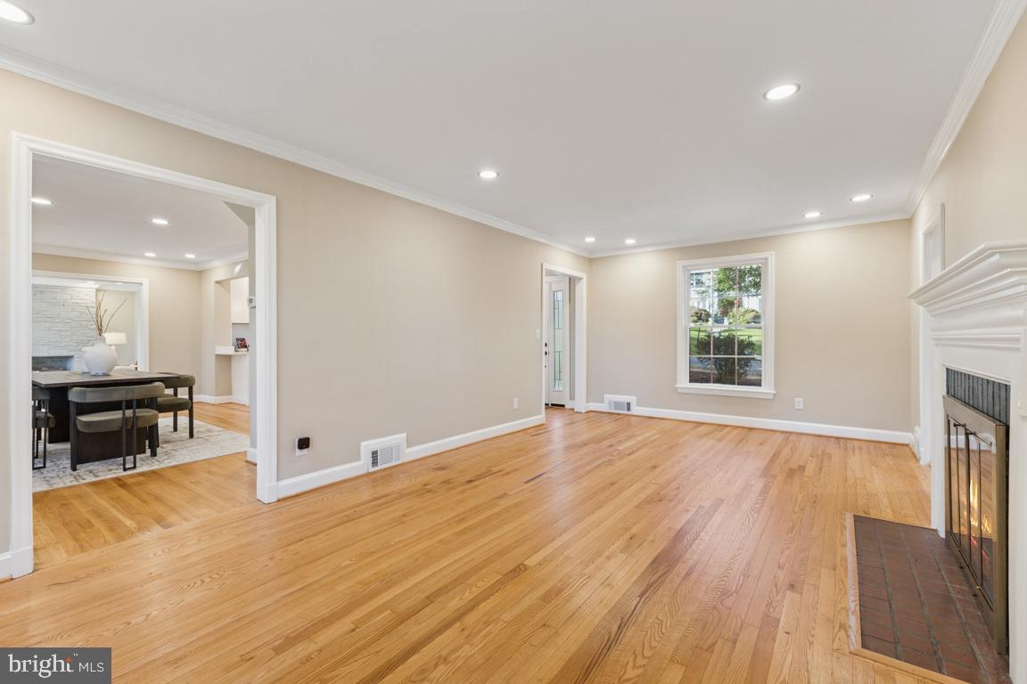1901 Belle Haven Road Alexandria, VA 22307 - Photo 17 of 52 a view of an empty room with wooden floor and a window