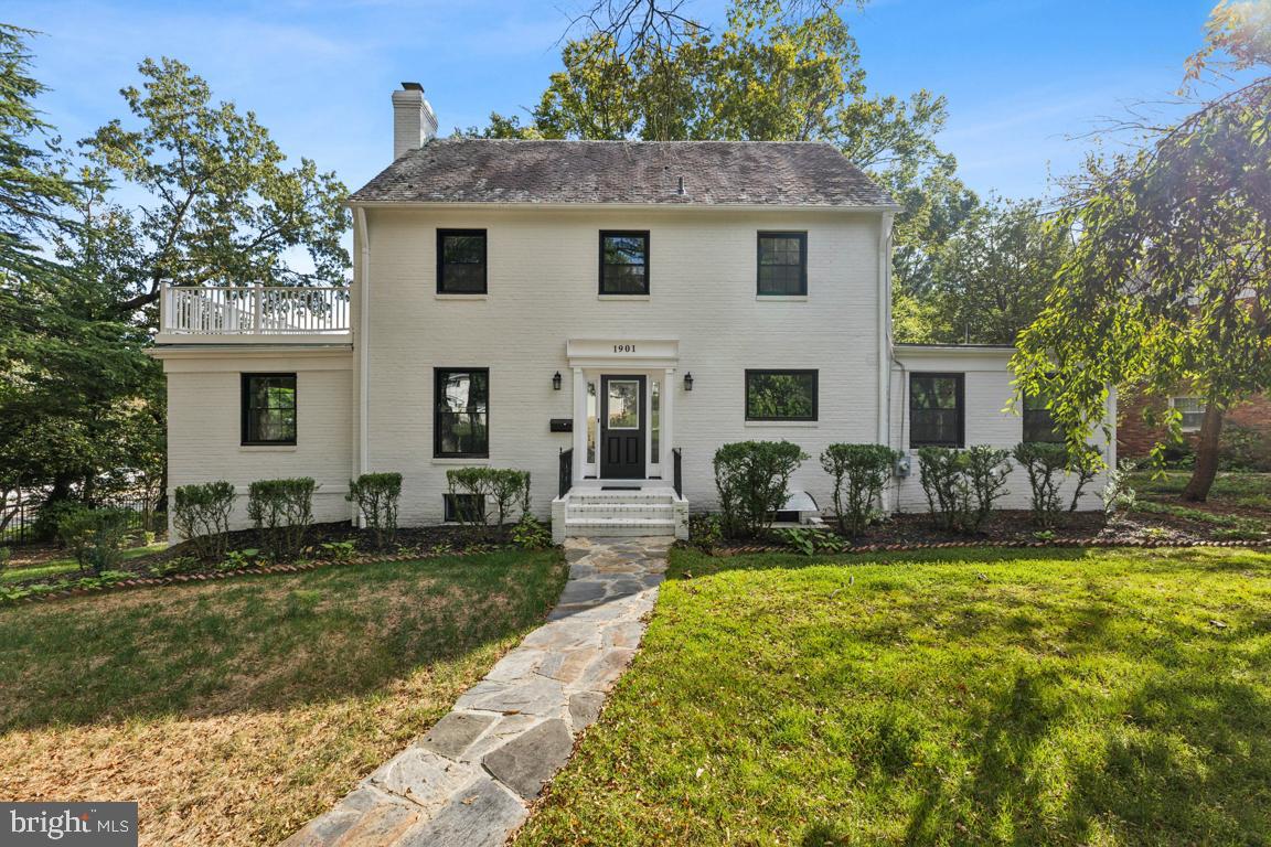 1901 Belle Haven Road Alexandria, VA 22307 - Photo 2 of 52 a front view of house with yard and trees in the background