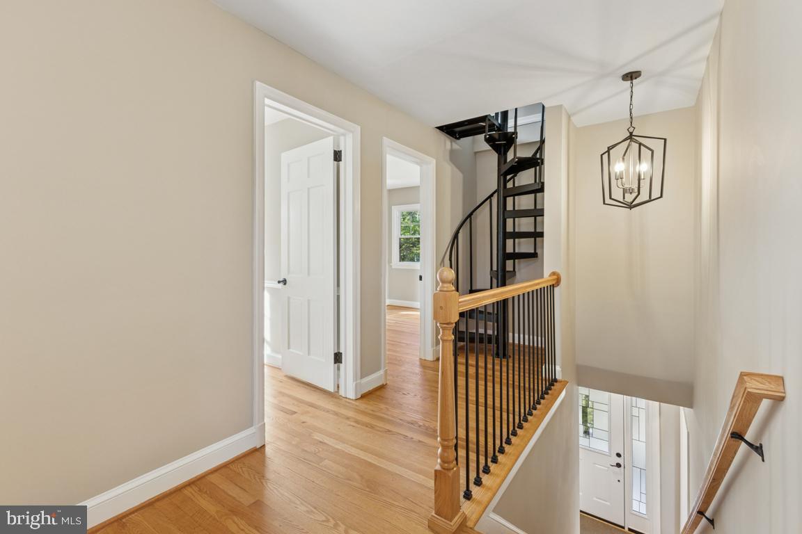 1901 Belle Haven Road Alexandria, VA 22307 - Photo 21 of 52 a view of a hallway with wooden floor and staircase