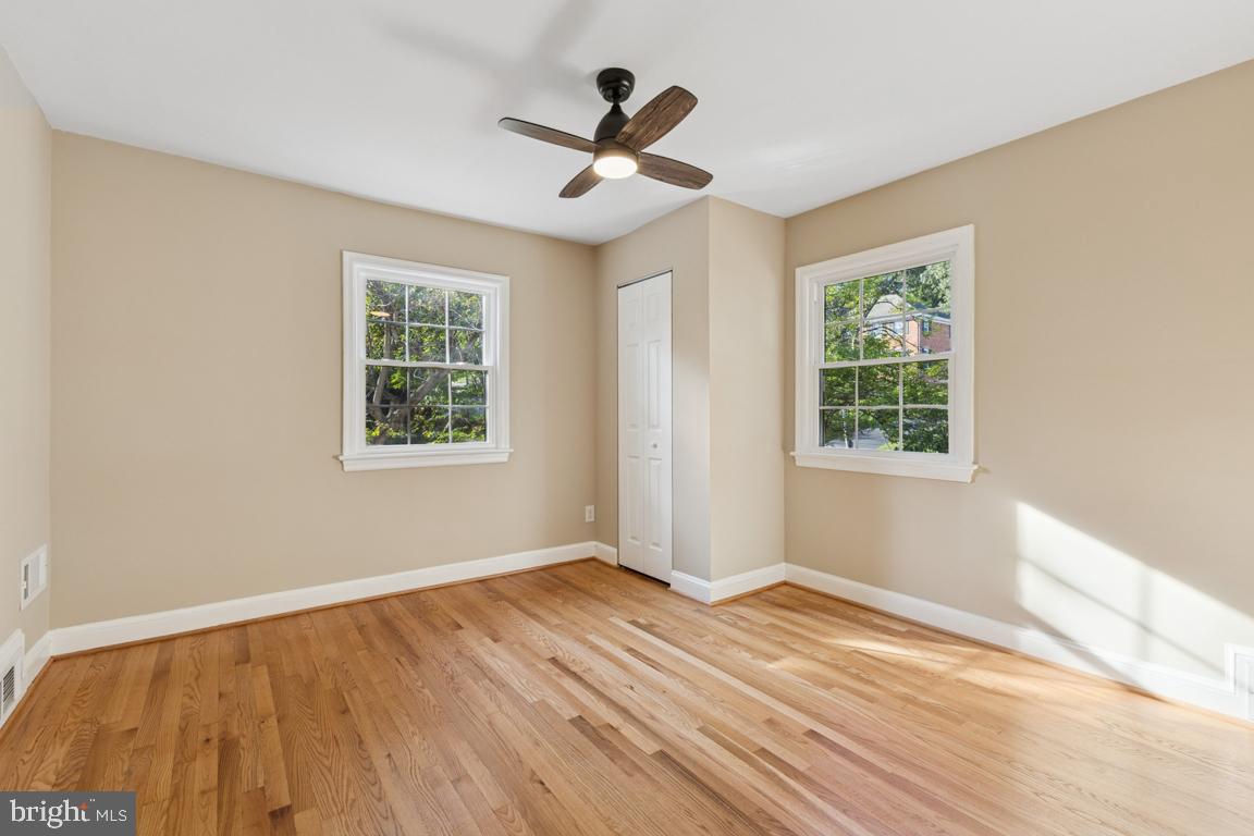 1901 Belle Haven Road Alexandria, VA 22307 - Photo 22 of 52 a view of an empty room with wooden floor and a window