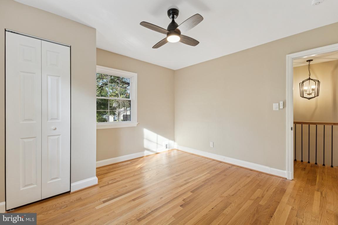 1901 Belle Haven Road Alexandria, VA 22307 - Photo 23 of 52 wooden floor in an empty room with a window