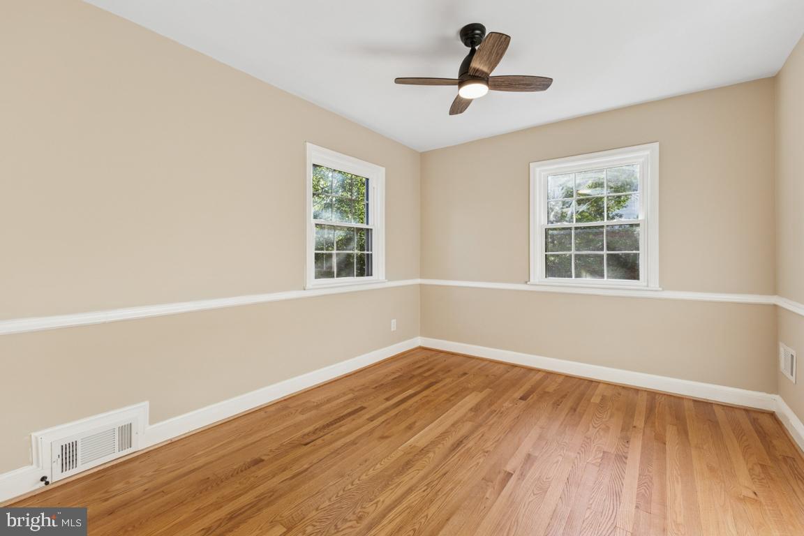 1901 Belle Haven Road Alexandria, VA 22307 - Photo 24 of 52 a view of empty room with wooden floor and fan