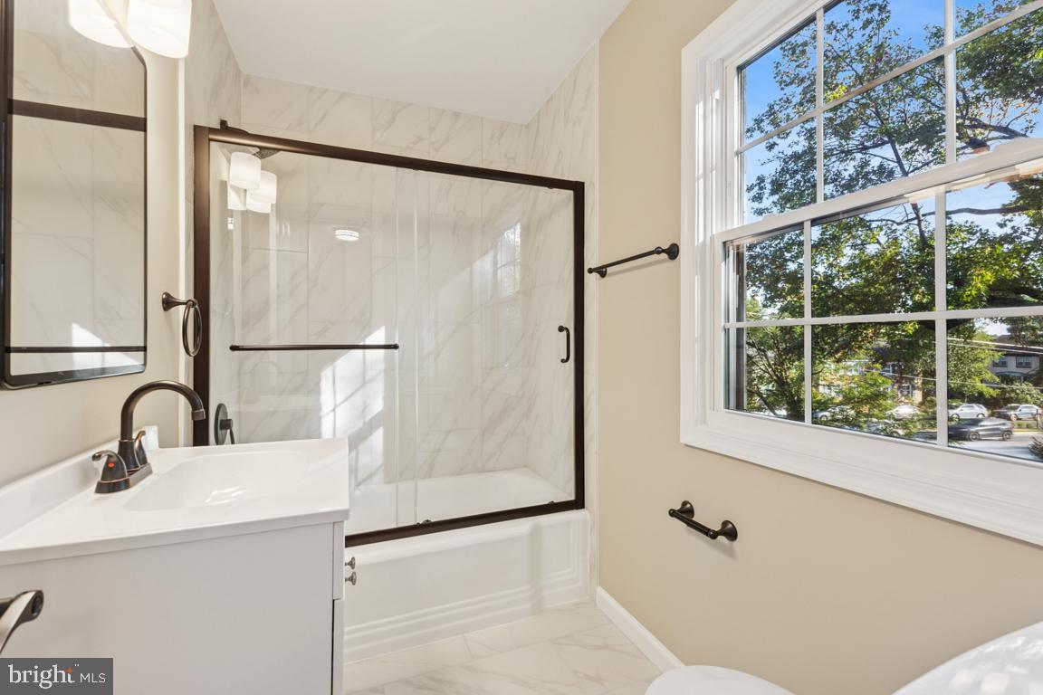 1901 Belle Haven Road Alexandria, VA 22307 - Photo 25 of 52 a bathroom with a sink and a mirror