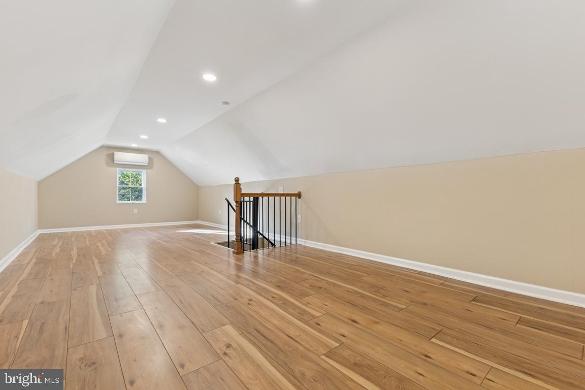 1901 Belle Haven Road Alexandria, VA 22307 - Photo 31 of 52 a view of an empty room with wooden floor and a window