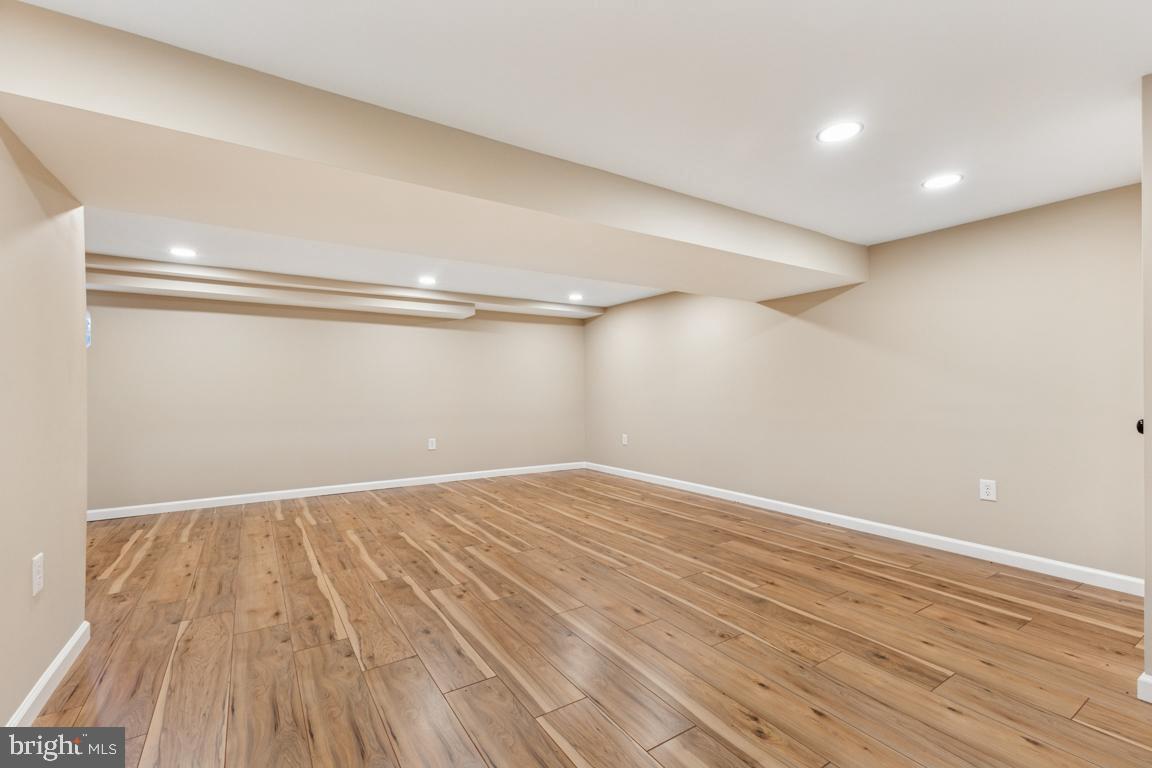 1901 Belle Haven Road Alexandria, VA 22307 - Photo 34 of 52 a view of an empty room with wooden floor and a window