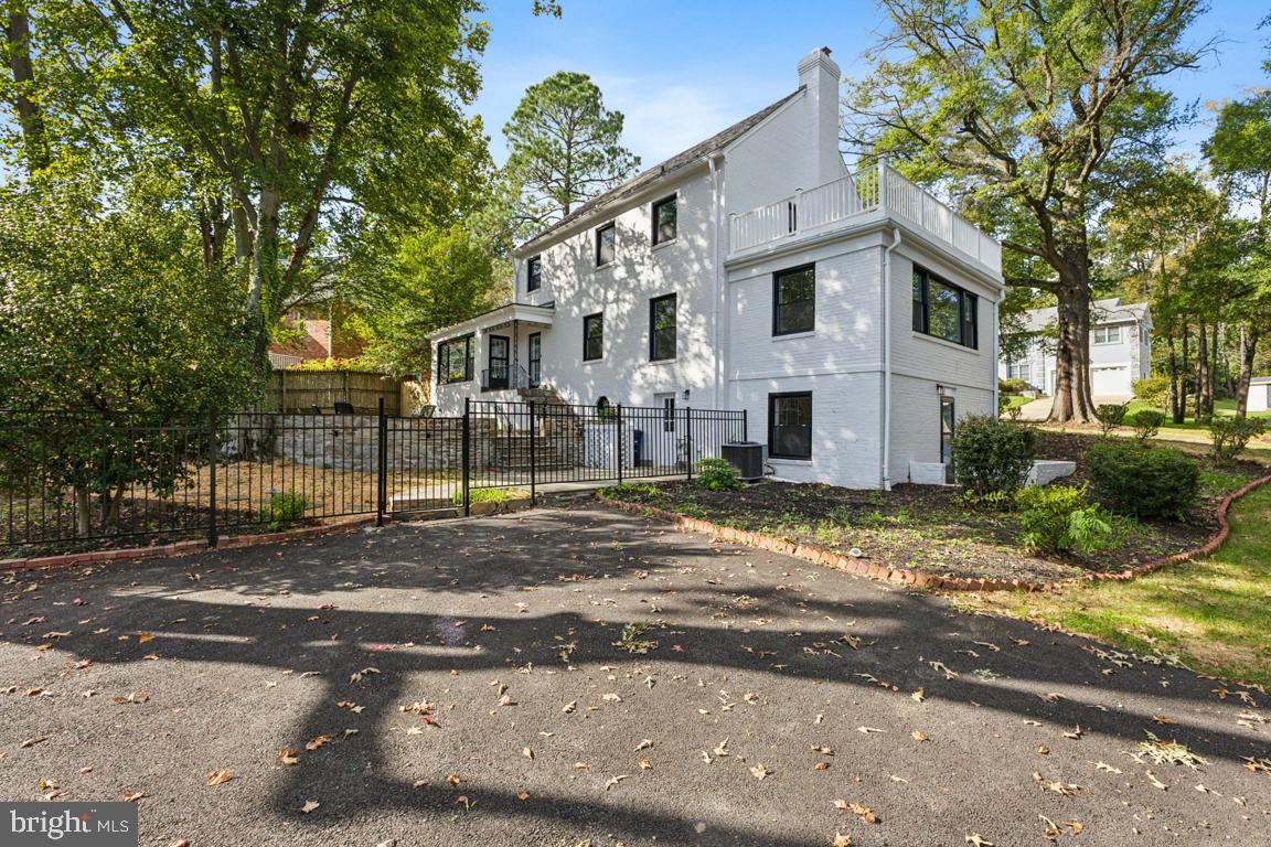 1901 Belle Haven Road Alexandria, VA 22307 - Photo 45 of 52 a view of a white house next to a road and yard