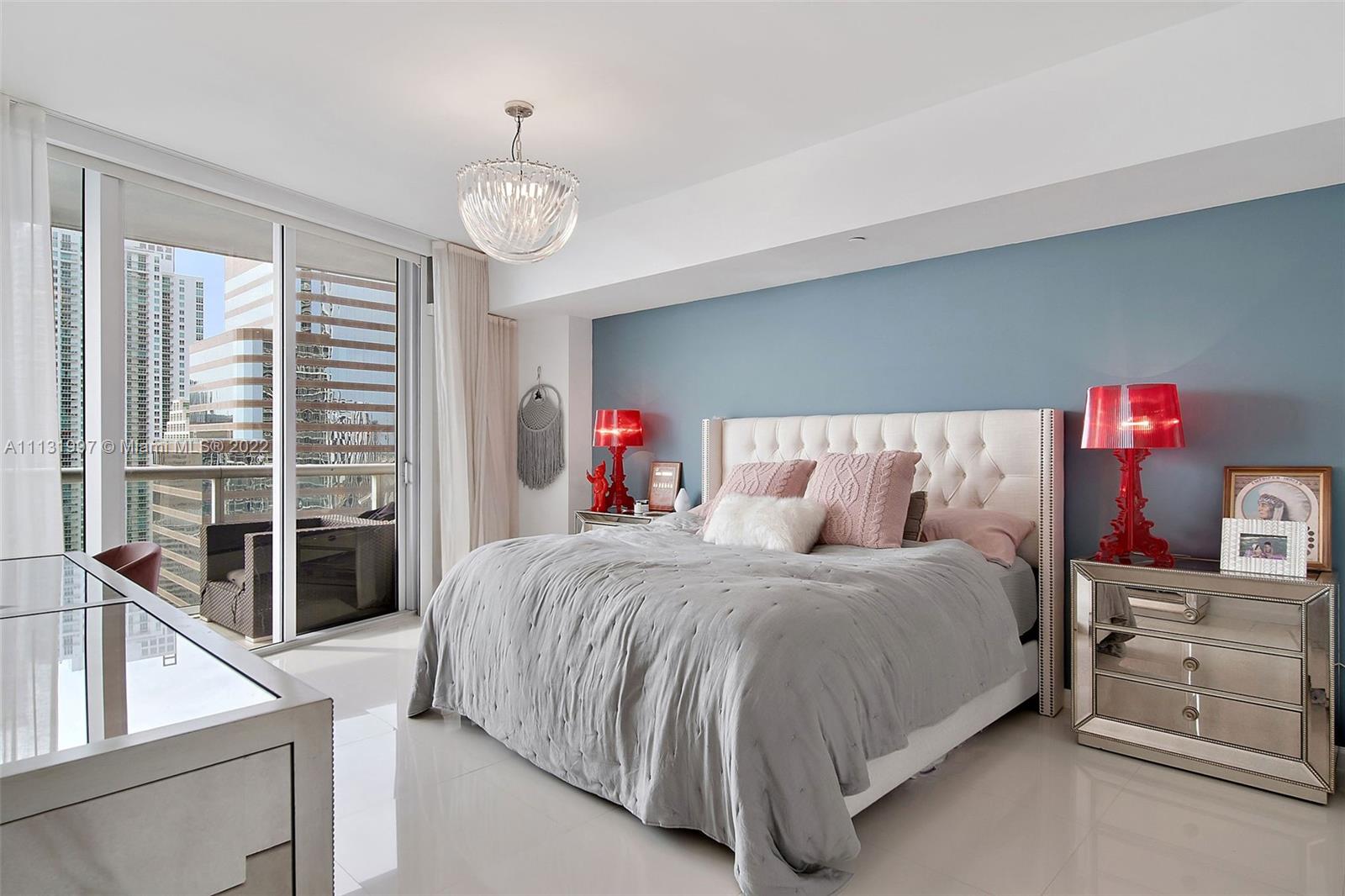 495 Brickell Avenue, Unit 3107 Miami, FL 33131 - Photo 17 of 41 a bedroom with a bed and a large window