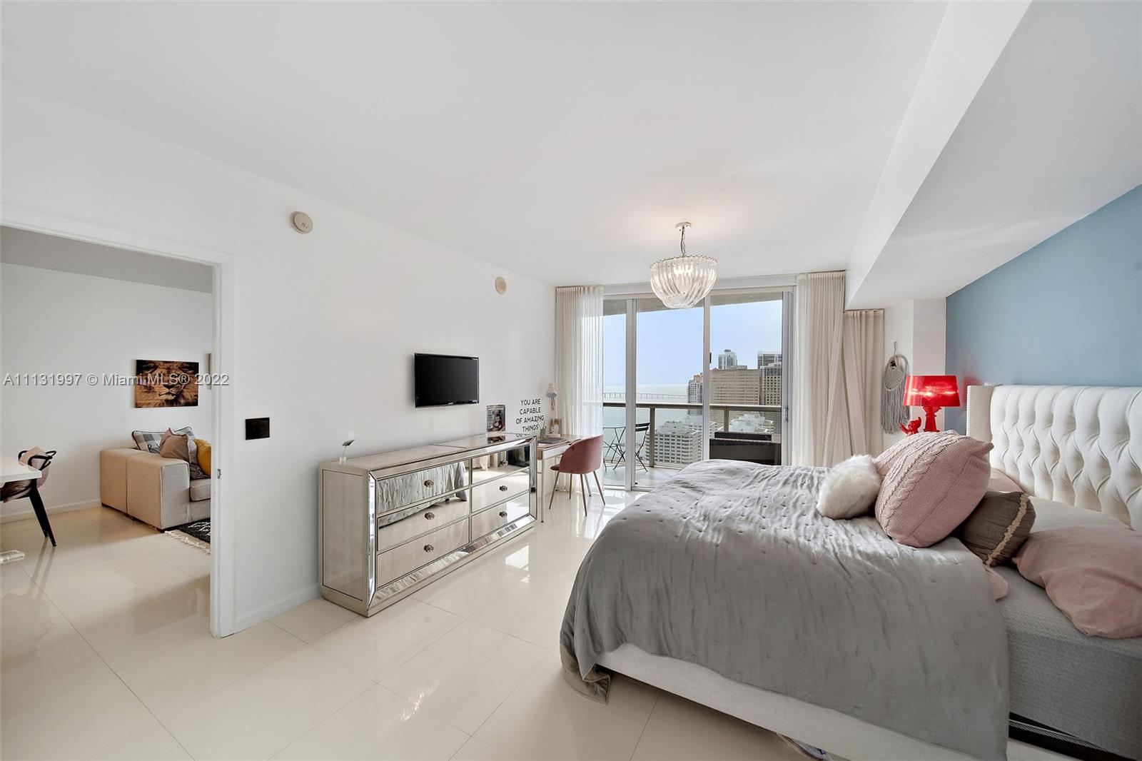 495 Brickell Avenue, Unit 3107 Miami, FL 33131 - Photo 18 of 41 a bedroom with a bed and a couch