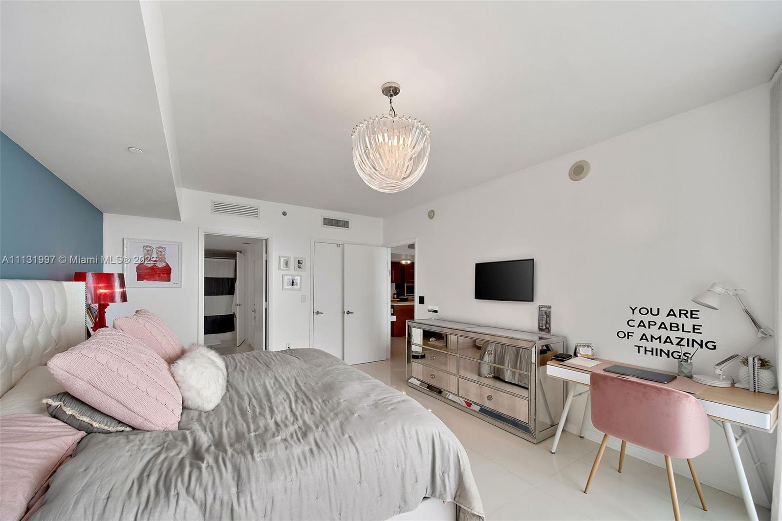 495 Brickell Avenue, Unit 3107 Miami, FL 33131 - Photo 21 of 41 a bedroom with a bed and a flat screen tv