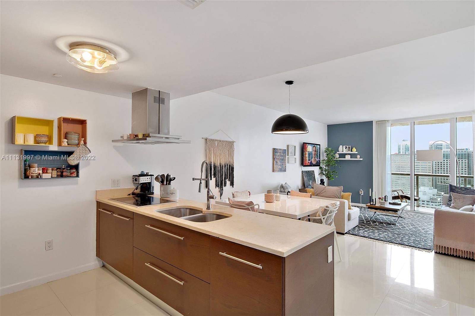 495 Brickell Avenue, Unit 3107 Miami, FL 33131 - Photo 3 of 41 a view of living room with granite countertop furniture and a kitchen view