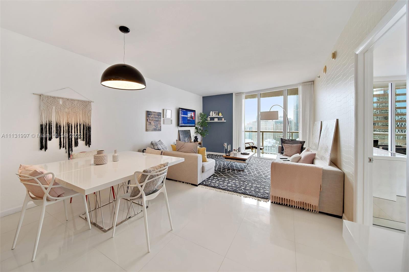 495 Brickell Avenue, Unit 3107 Miami, FL 33131 - Photo 7 of 41 a living room with furniture and a large window