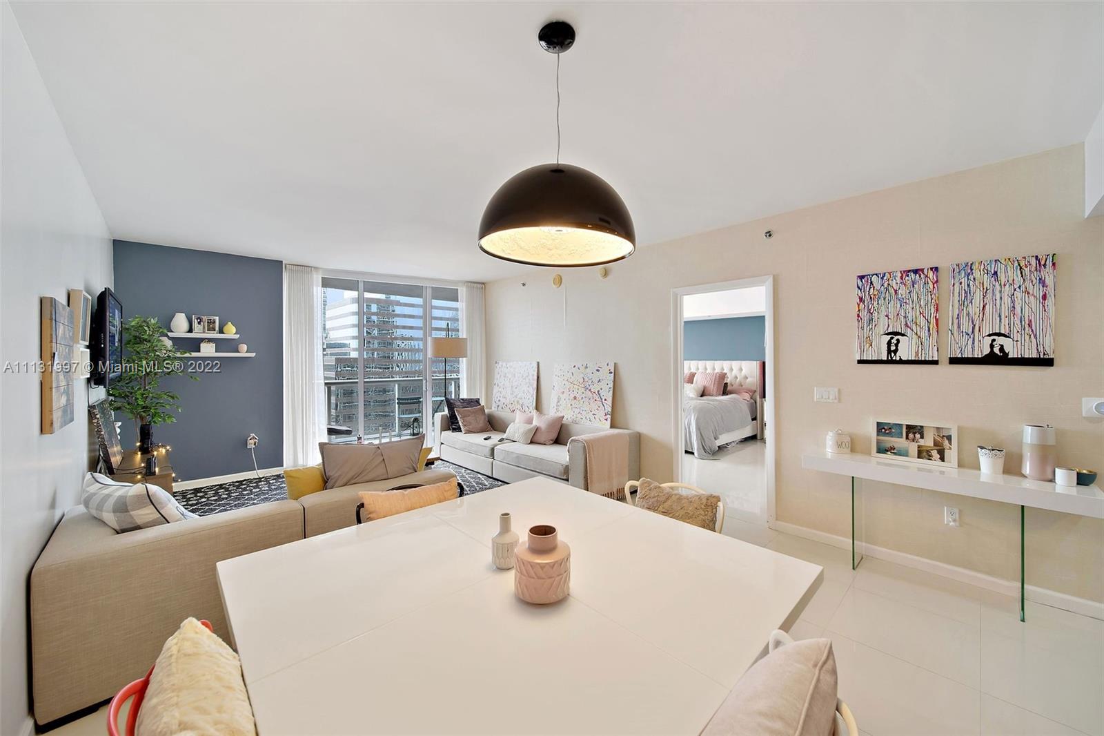 495 Brickell Avenue, Unit 3107 Miami, FL 33131 - Photo 8 of 41 a living room with furniture and a potted plant