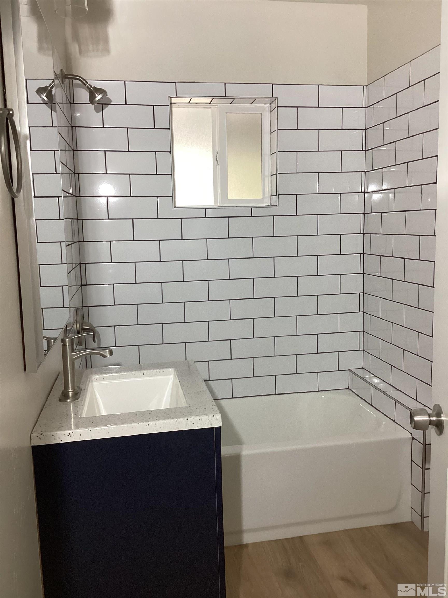 235 Caliente Street, Unit CALIENTE ST 1 & 2 Reno, NV 89509 - Photo 12 of 25 a bathroom with a sink and bathtub