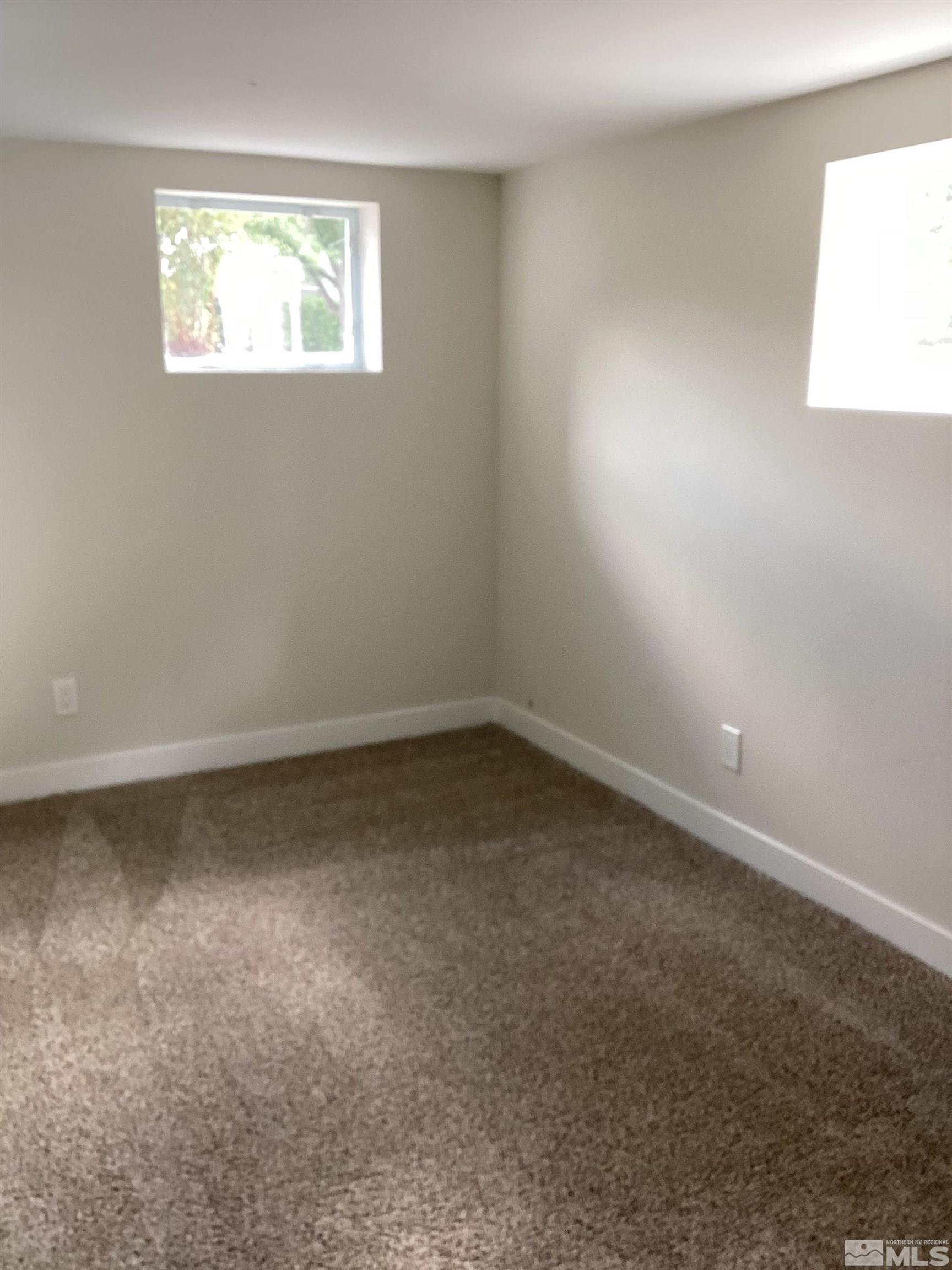 235 Caliente Street, Unit CALIENTE ST 1 & 2 Reno, NV 89509 - Photo 20 of 25 an empty room with a window