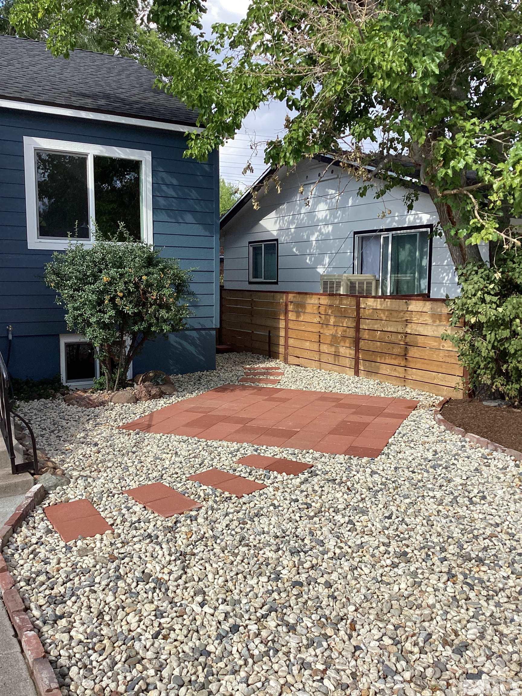 235 Caliente Street, Unit CALIENTE ST 1 & 2 Reno, NV 89509 - Photo 2 of 25 a front view of a house with a yard