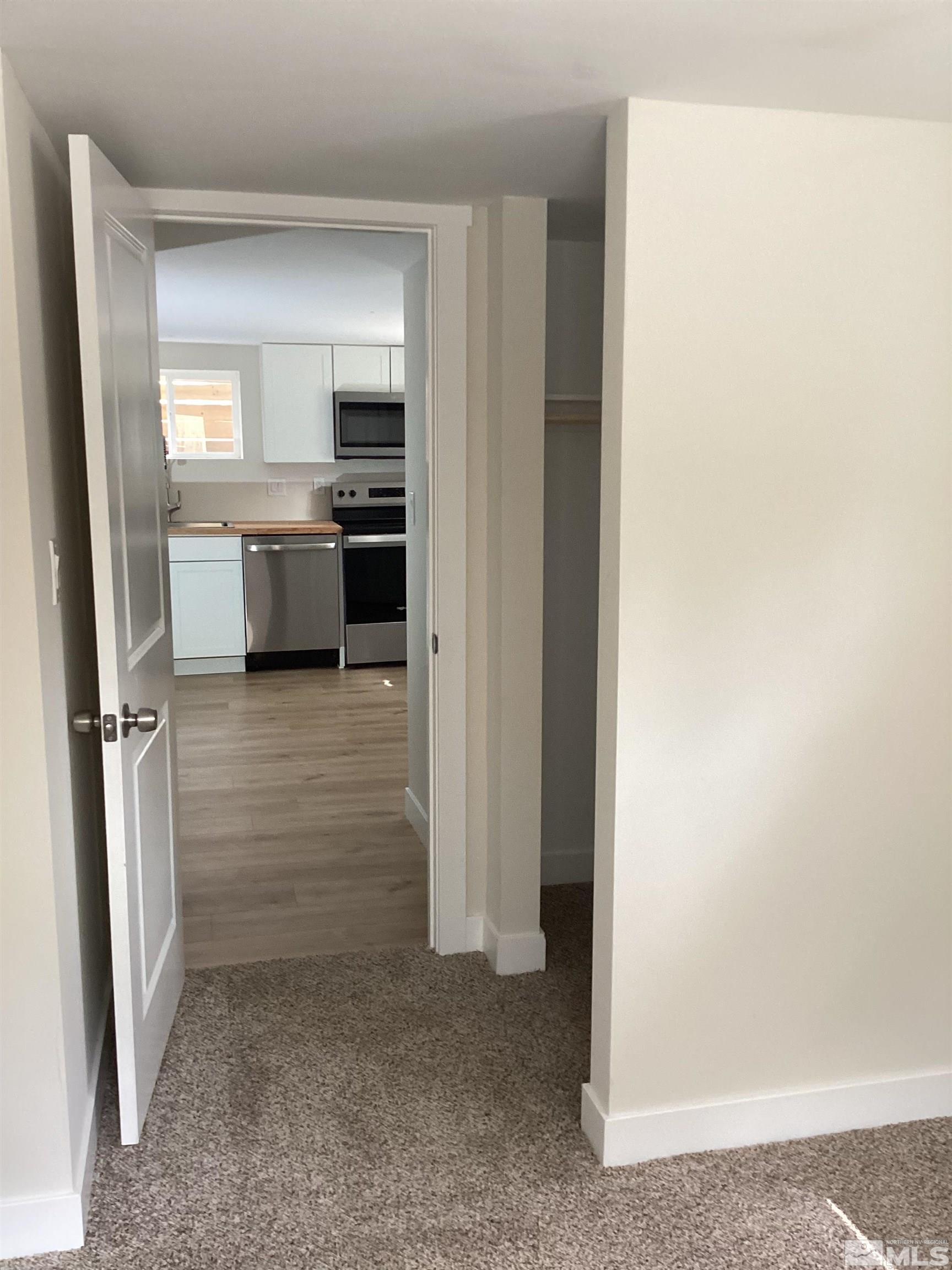 235 Caliente Street, Unit CALIENTE ST 1 & 2 Reno, NV 89509 - Photo 22 of 25 hallway with white cabinets and sink