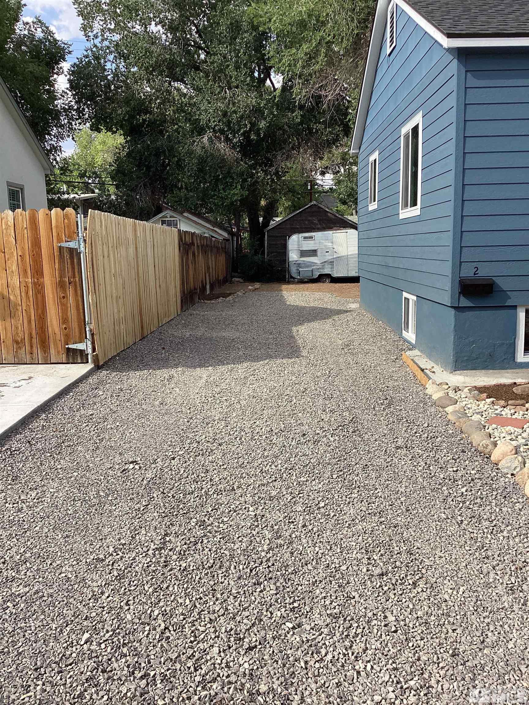 235 Caliente Street, Unit CALIENTE ST 1 & 2 Reno, NV 89509 - Photo 3 of 25 a view of a house with a back yard