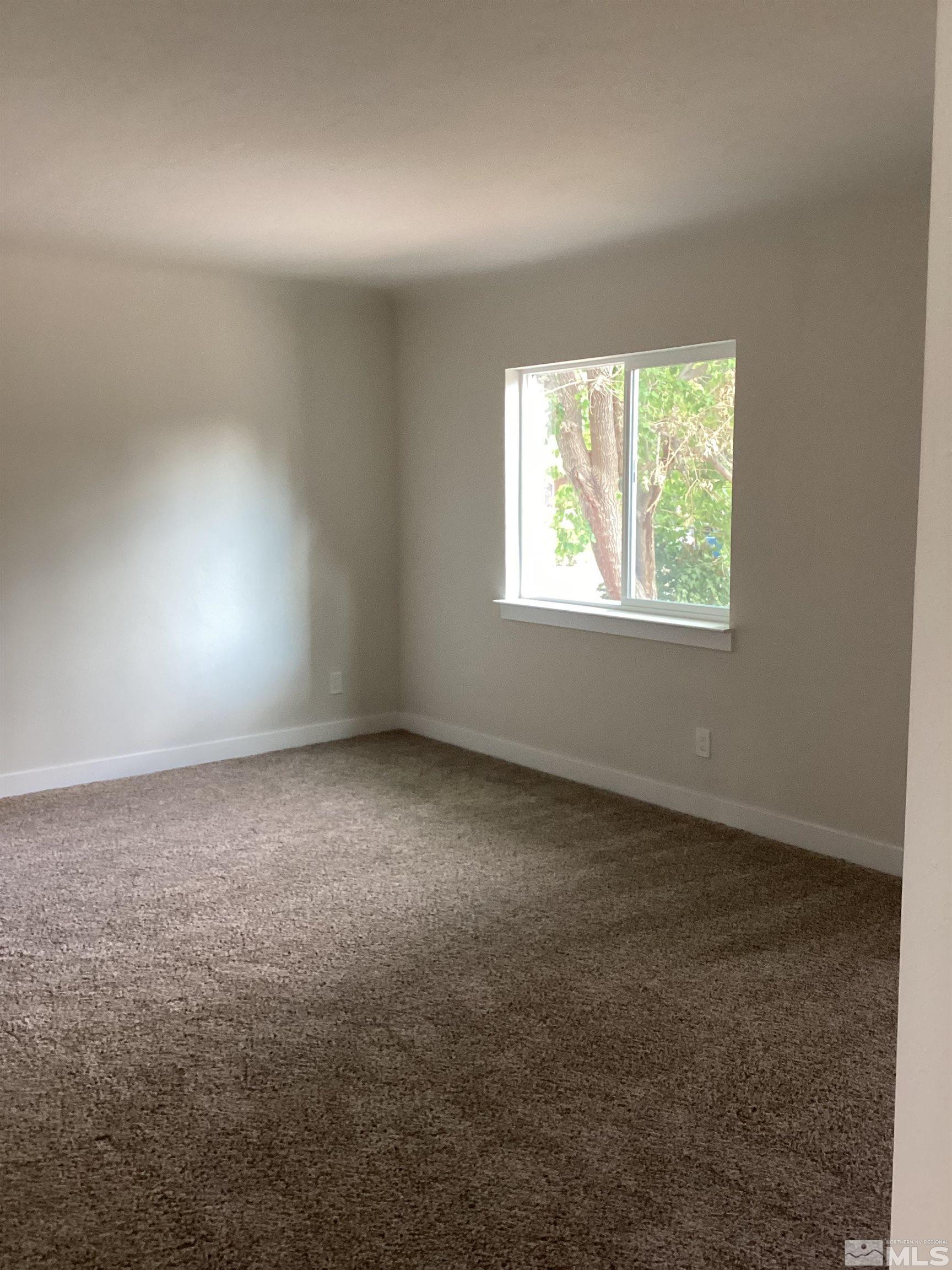 235 Caliente Street, Unit CALIENTE ST 1 & 2 Reno, NV 89509 - Photo 6 of 25 an empty room with a window