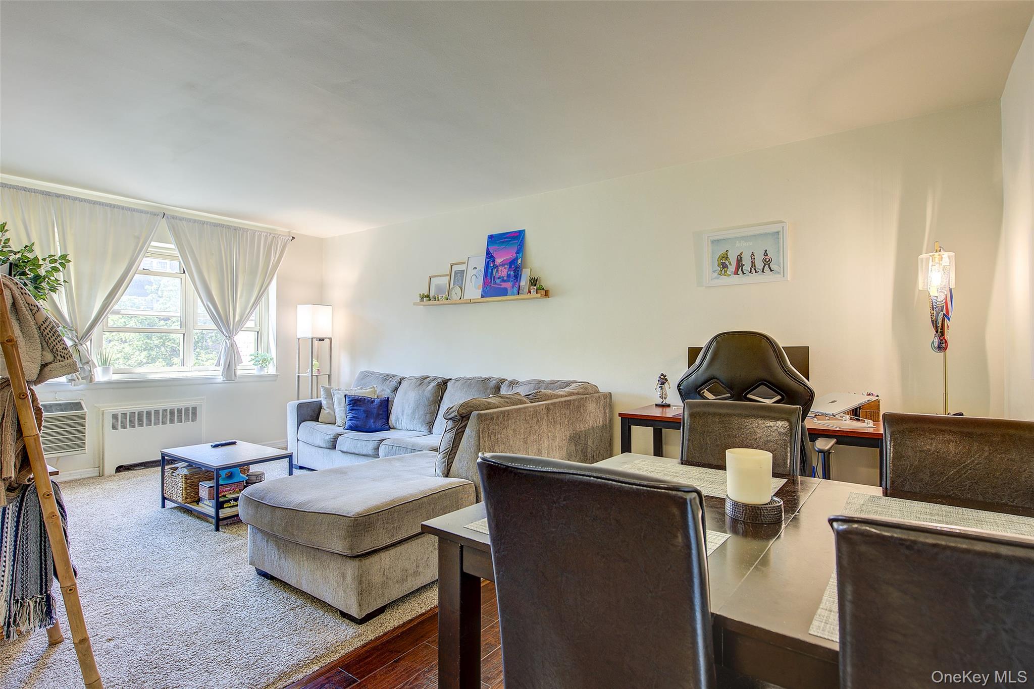 144-60 Gravett Road, Unit 4J Queens, NY 11367 - Photo 11 of 38 a living room with furniture a window and a flat screen tv