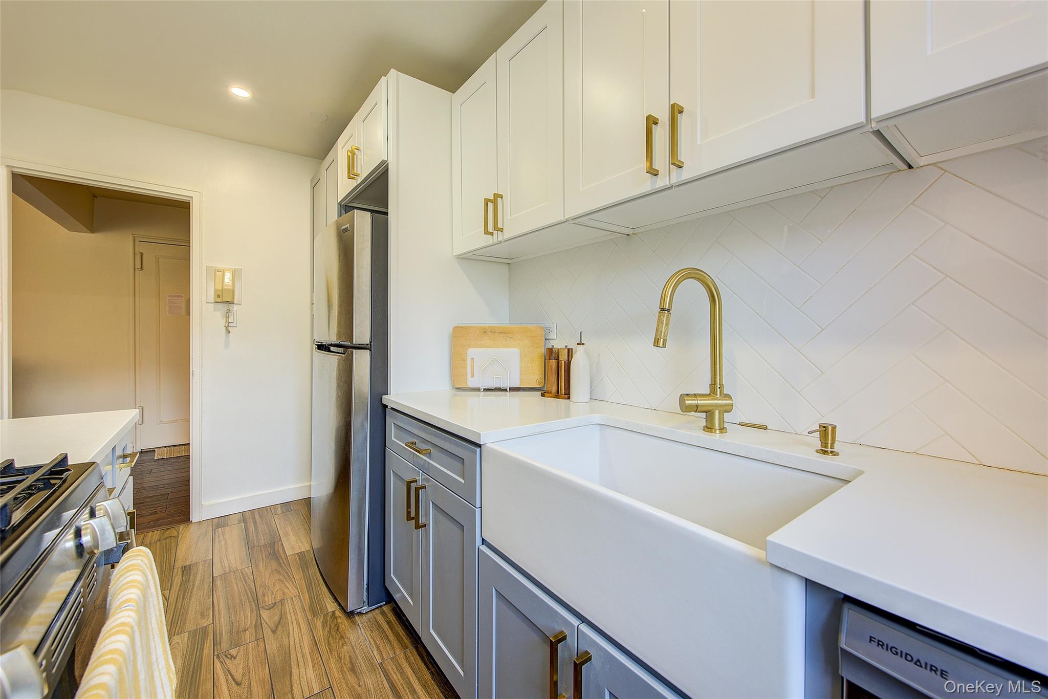 144-60 Gravett Road, Unit 4J Queens, NY 11367 - Photo 24 of 38 a kitchen with a sink appliances and cabinets