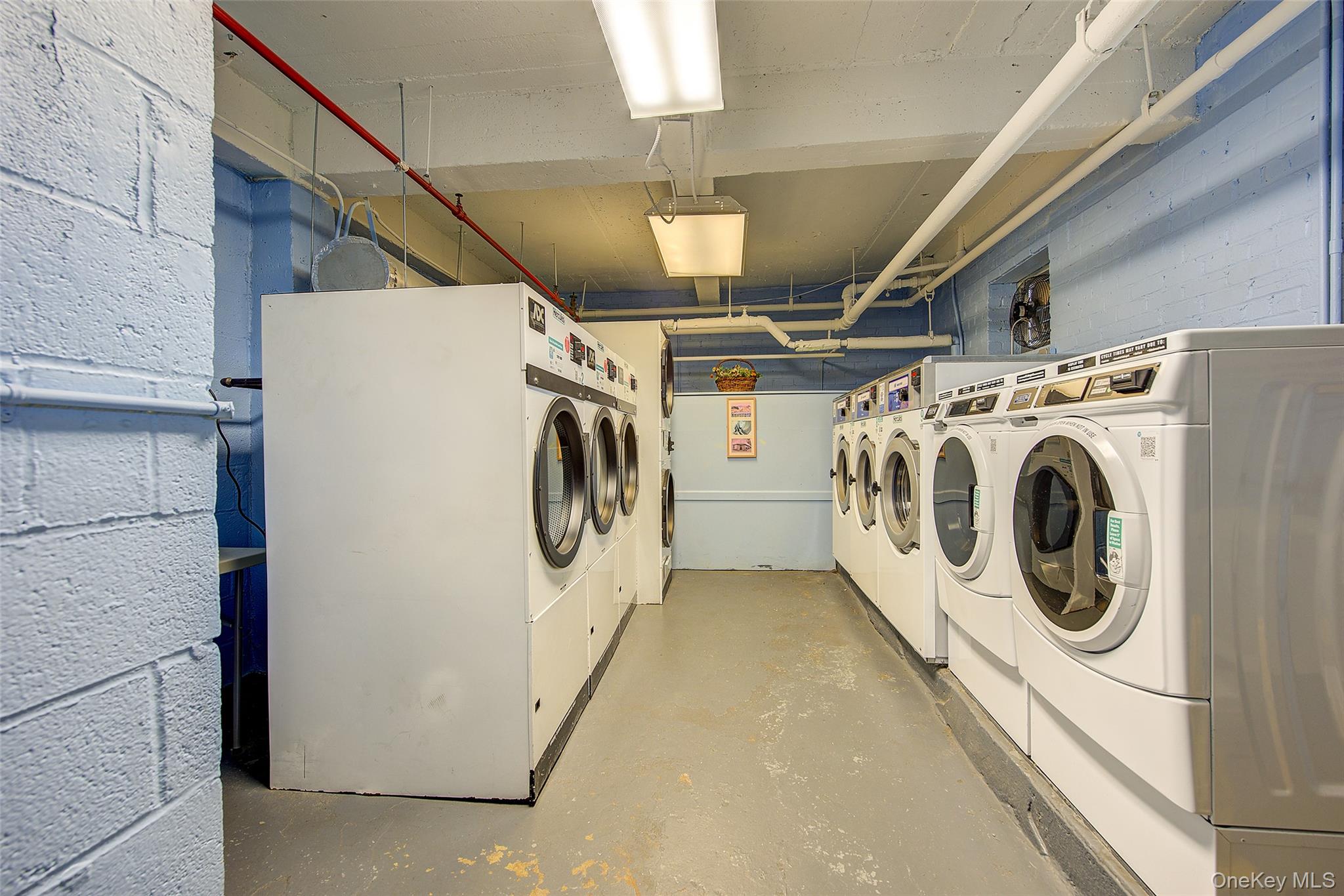 144-60 Gravett Road, Unit 4J Queens, NY 11367 - Photo 32 of 38 a utility room with dryer and washer