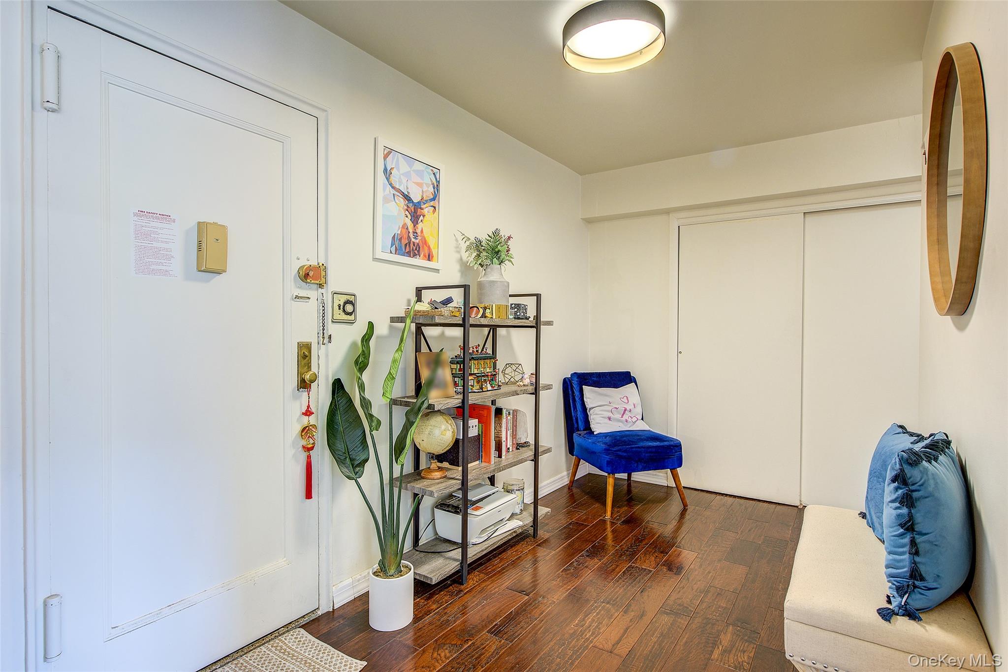 144-60 Gravett Road, Unit 4J Queens, NY 11367 - Photo 5 of 38 a view of a workspace with furniture and wooden floor