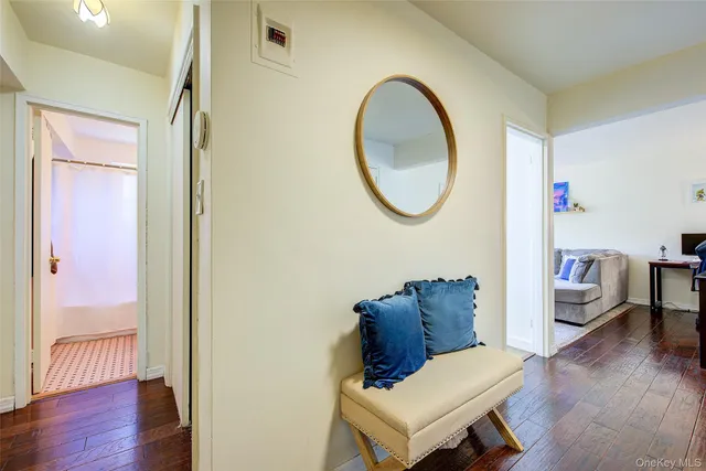 a view of living room with furniture and wooden floor