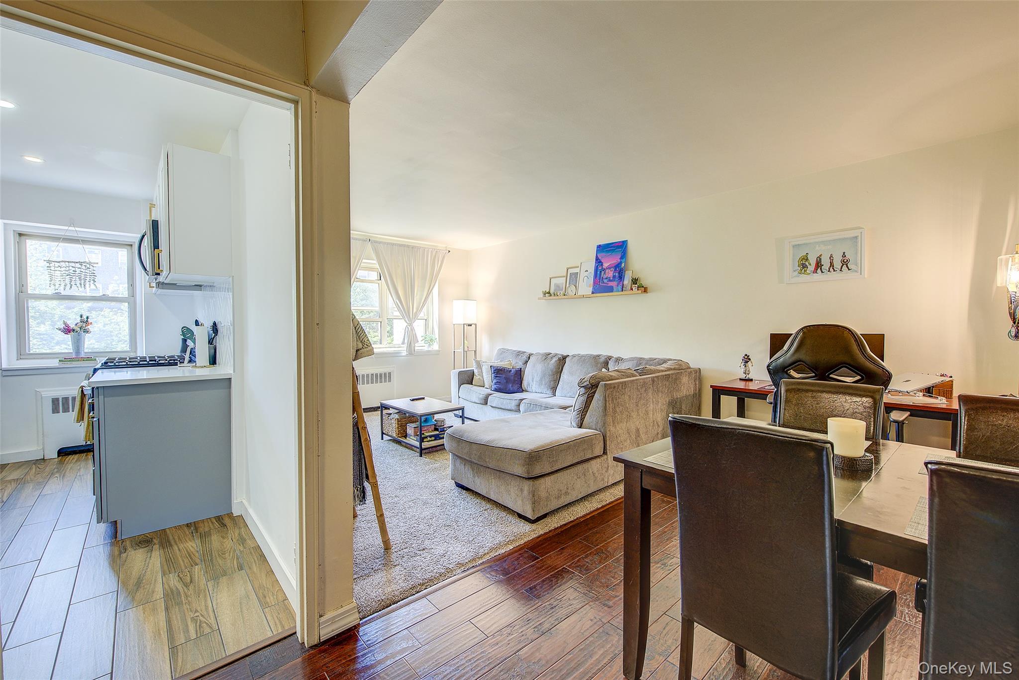 144-60 Gravett Road, Unit 4J Queens, NY 11367 - Photo 9 of 38 a living room with furniture and a wooden floor