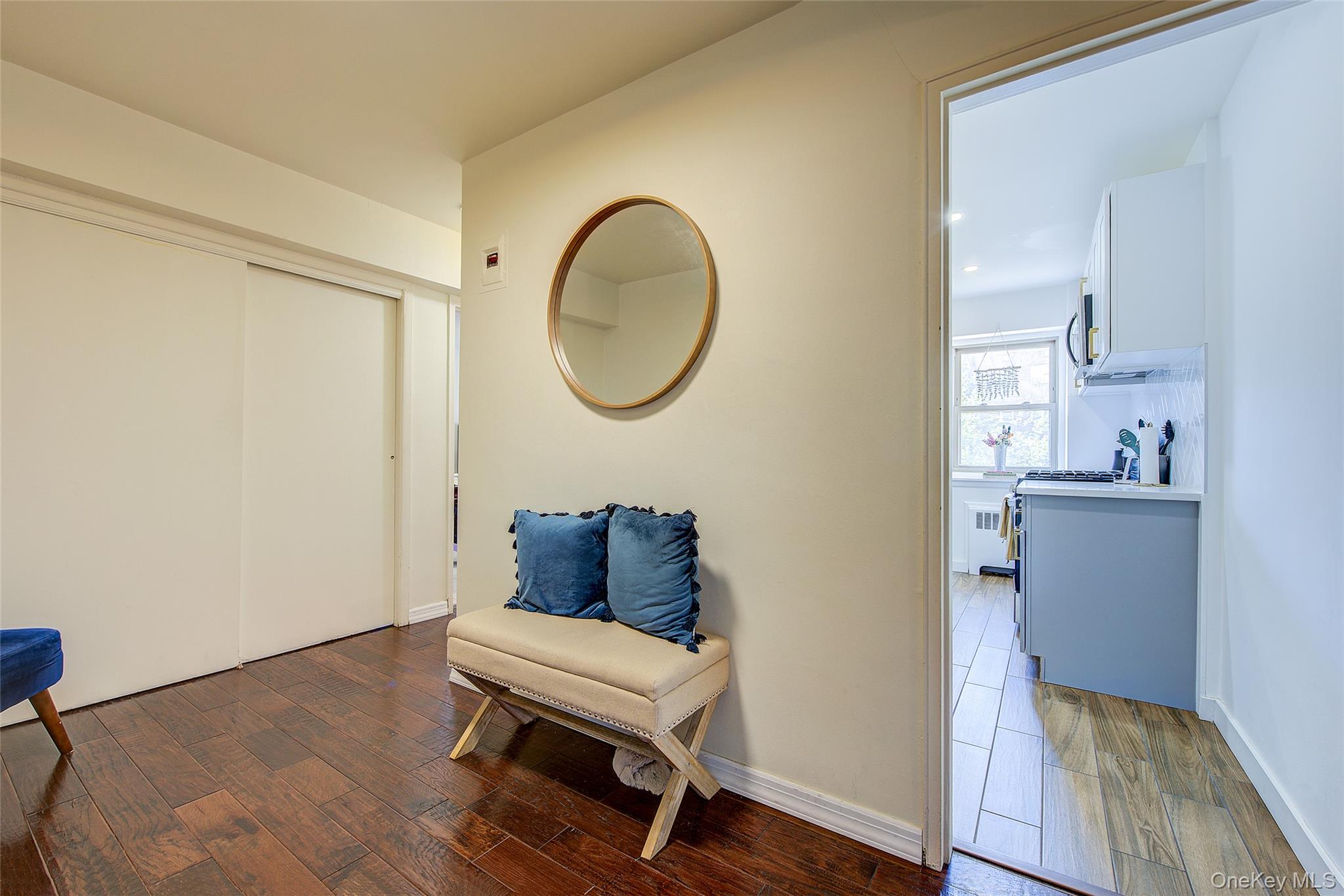 144-60 Gravett Road, Unit 4J Queens, NY 11367 - Photo 10 of 38 a view of a livingroom with wooden floor and a sink