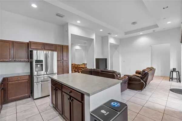 a kitchen with a stove a refrigerator and a sink