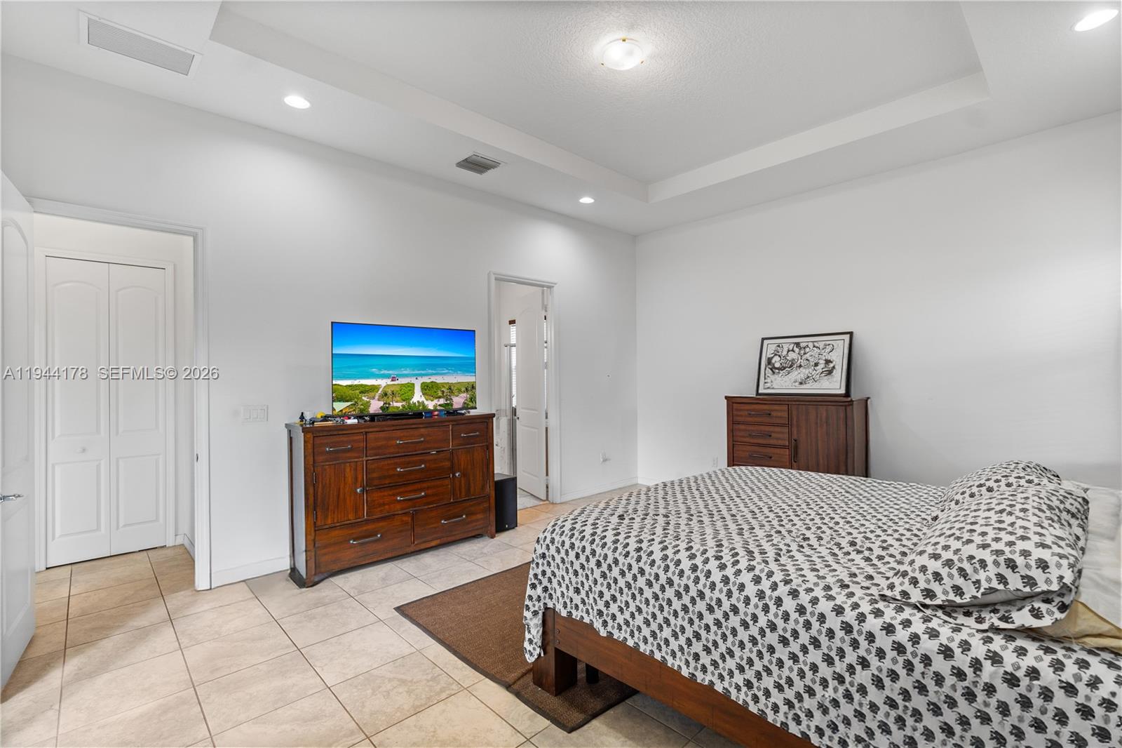 15102 Southwest 177th Terrace Miami, FL 33187 - Photo 16 of 38 a bedroom with a bed and a dresser
