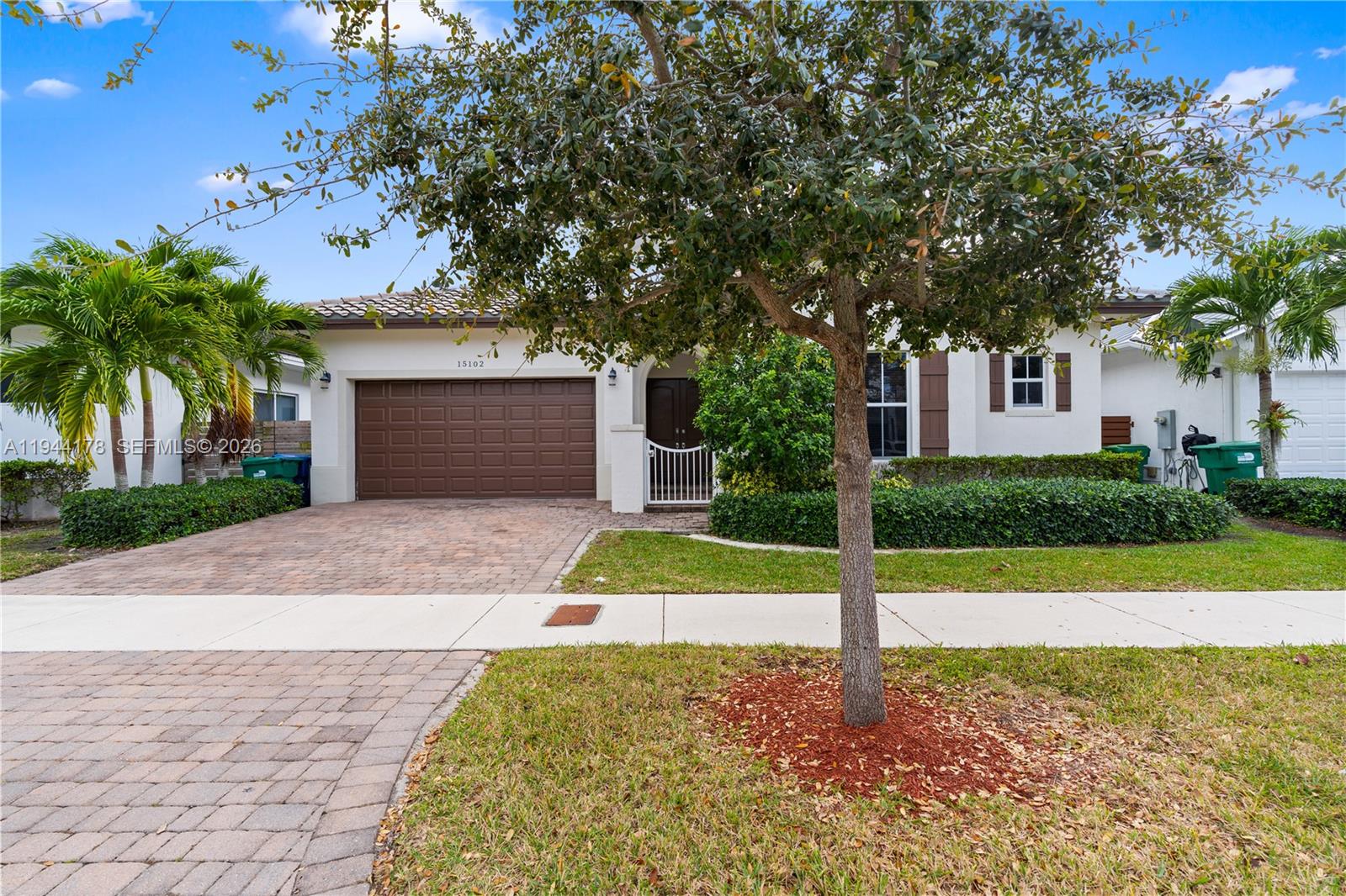 15102 Southwest 177th Terrace Miami, FL 33187 - Photo 3 of 38 a house view with a garden space