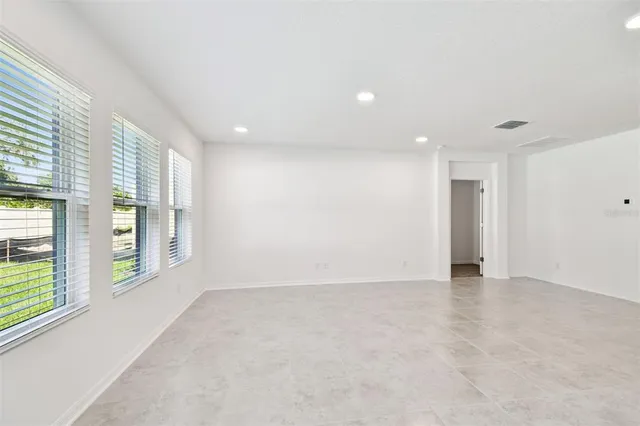 an empty room with windows