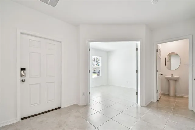 wooden floor with white walls