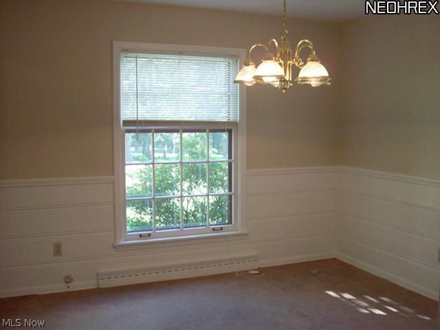 2586 Copley Road Akron, OH 44321 - Photo 3 of 21 Located to the left of the foyer is the home's dining room with wainscoting, chair rail trim and chandelier.
