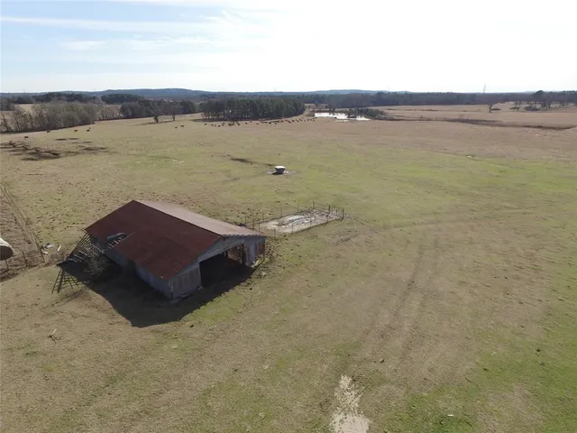 a aerial view of a lake with a mountain in the back